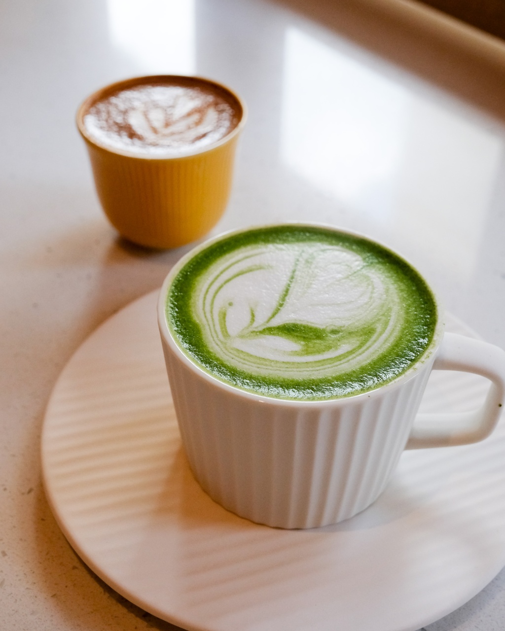 From top: Piccolo and matcha latte