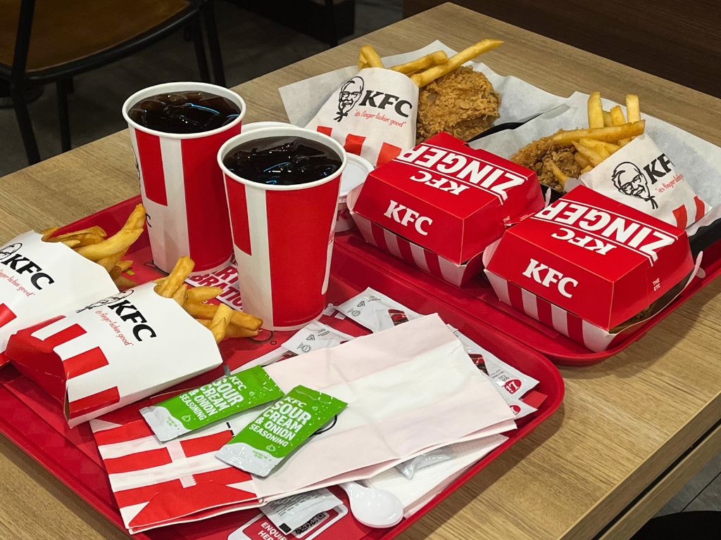 The Ultimate Smokey burger box and Smokey hot Zinger box, alongside two sour cream & onion shaker fries. Photo: Angeline Ang/HungryGoWhere kfc ultimate smokey burger