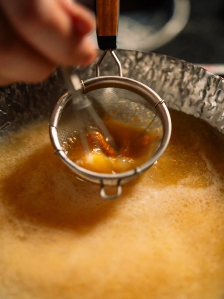 Blink and you might miss the chefs blending the creamy uni into your hotpot broth. Photo: Morita Unigoro morita unigoro
