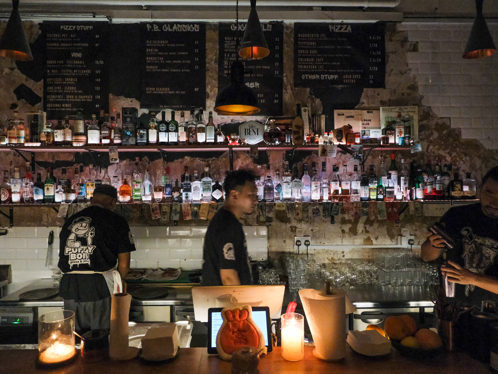 Jason, Sam, and Zul keep things grounded with their easygoing service, sharp bar skills, and solid pizza-making chops. Photo: Gary Lim/HungryGoWhere Puffy Bois