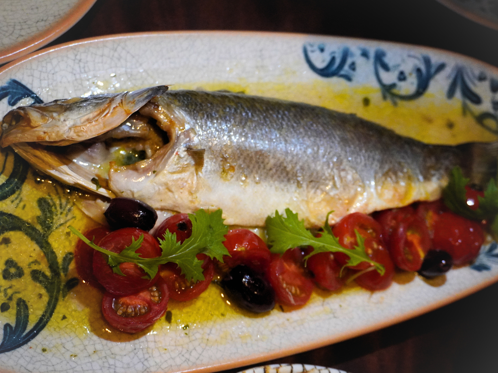 Impressively deboned and reassembled, the Sardinian seabass arrives glistening. Photo: Angeline Ang/HungryGoWhere Altro Zafferano Italian Restaurant