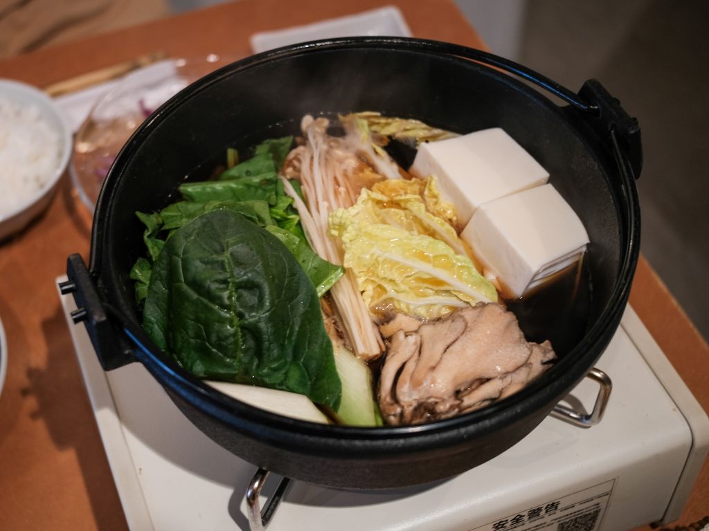 The sukiyaki features a healthy serving of vegetables within a cast iron pot. Photo: Gaelmaine Hoong/HungryGoWhere Towa Singapore