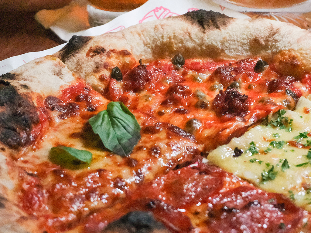 Clockwise from left — Margherita, nduja-roni, calamari zaff, pepperoni pizza. Photo: Gary Lim/HungryGoWhere Puffy Bois