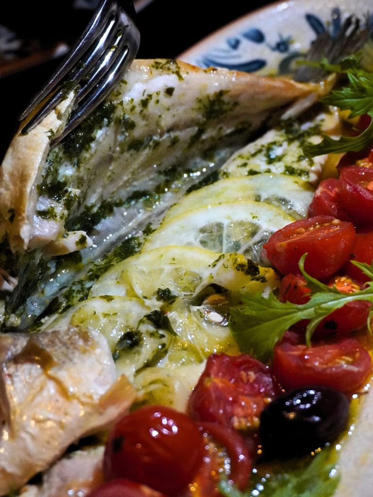 A peek beneath the surface reveals tender, flake-apart flesh infused with citrus and herb aromas. Photo: Angeline Ang/HungryGoWhere Altro Zafferano Italian Restaurant