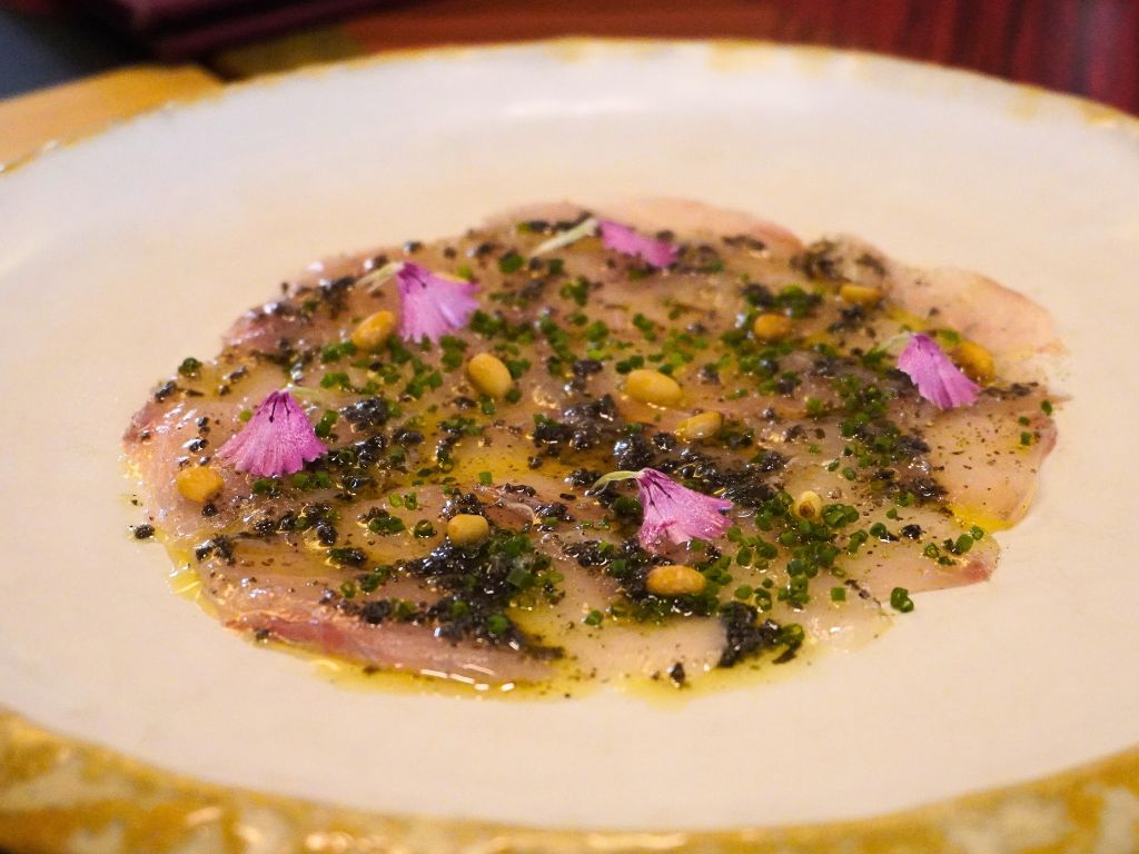 Carpaccio de lubina con vinagreta de trufa negra or seabass carpaccio with truffle dressing. Photo: Angeline Ang/HungryGoWhere binomio raffles hotel singapore
