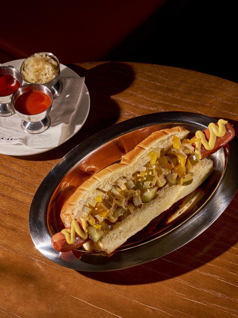 The Silver Service hot dog, which comprises a thick wagyu beef hotdog. Photo: Coach Bar coach bar singapore keong saik