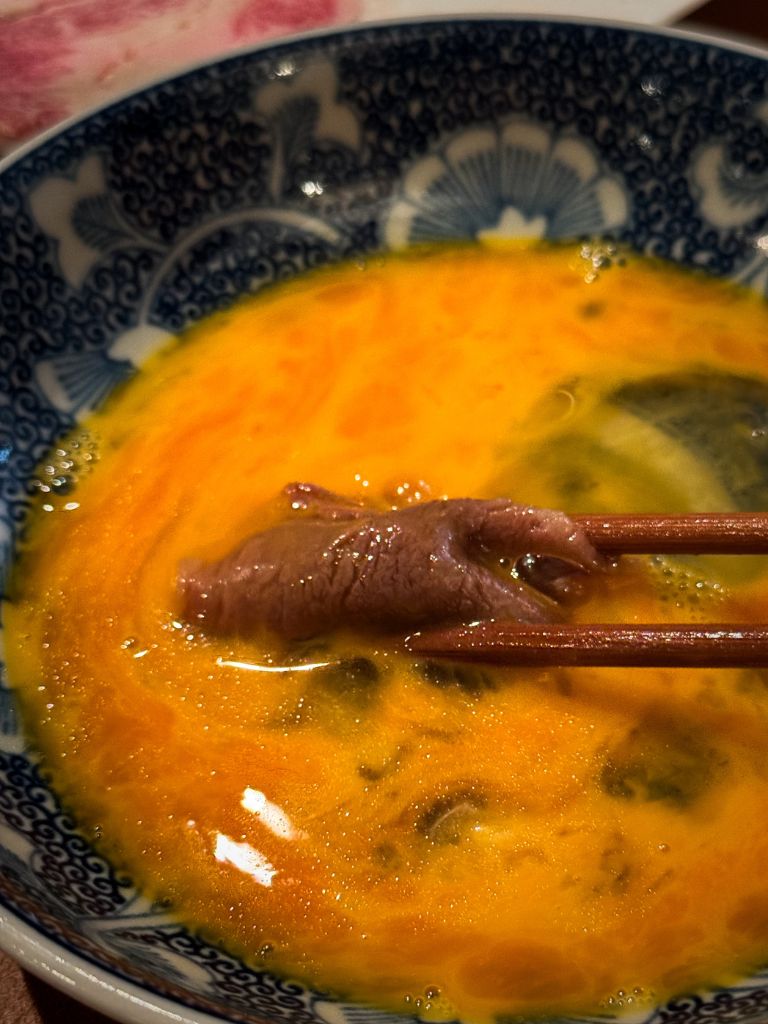 Dip the piping hot meat into the silky eggs before digging in. Photo: Gaelmaine Hoong/HungryGoWhere Towa Singapore