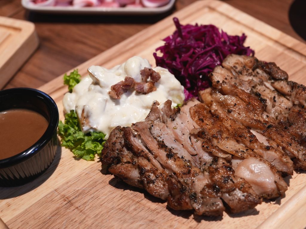Juicy grilled chicken chop with a side of cold, creamy potato salad. Photo: Angeline Ang/HungryGoWhere fairprice finest sembawang