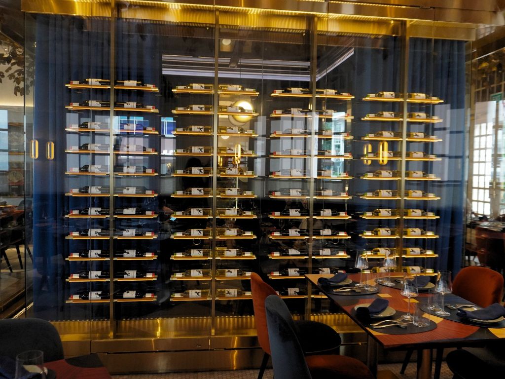 The exterior of the private room is framed by wine-lined walls and enclosed with curtains for added privacy. Photo: Angeline Ang/HungryGoWhere binomio raffles hotel singapore