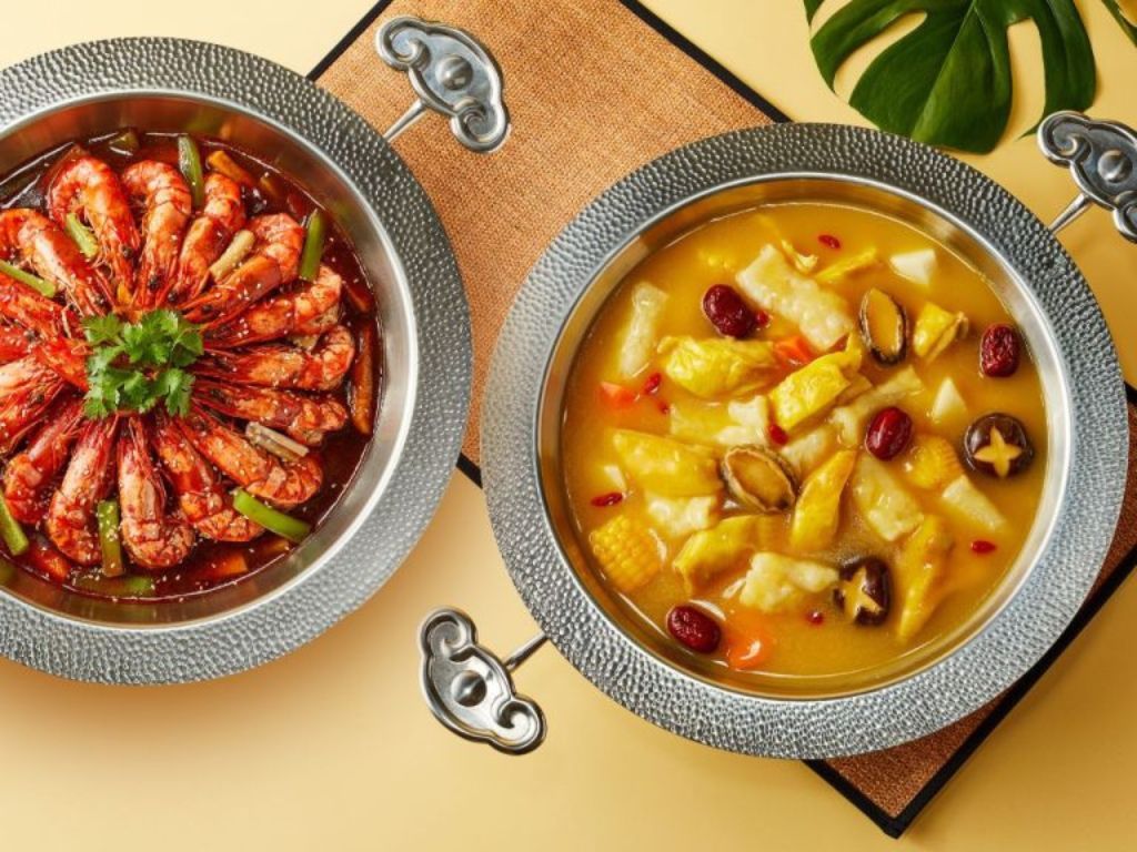 Hi Hot Pot’s classic secret soy aromatic spiced shrimp (left) and signature Hong Kong golden soup with fish maw (right). Photo: Hi Hot Pot steamboat singapore