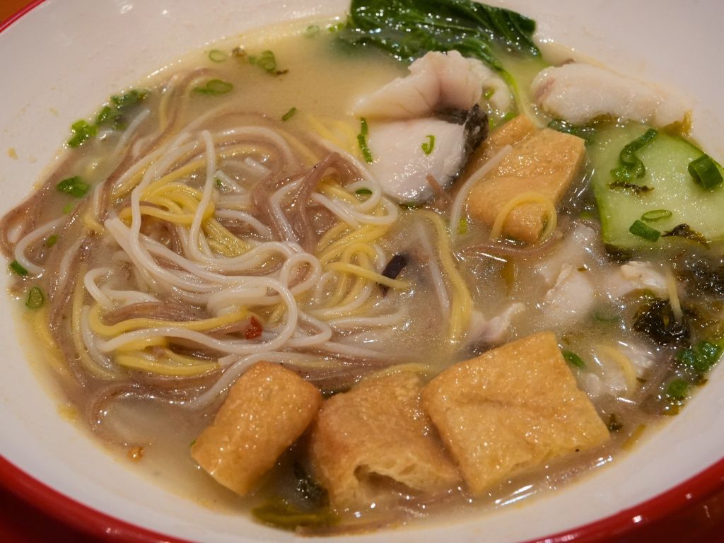 Golden sauerkraut broth. Photo: Angeline Ang/HungryGoWhere xiao yu hao
