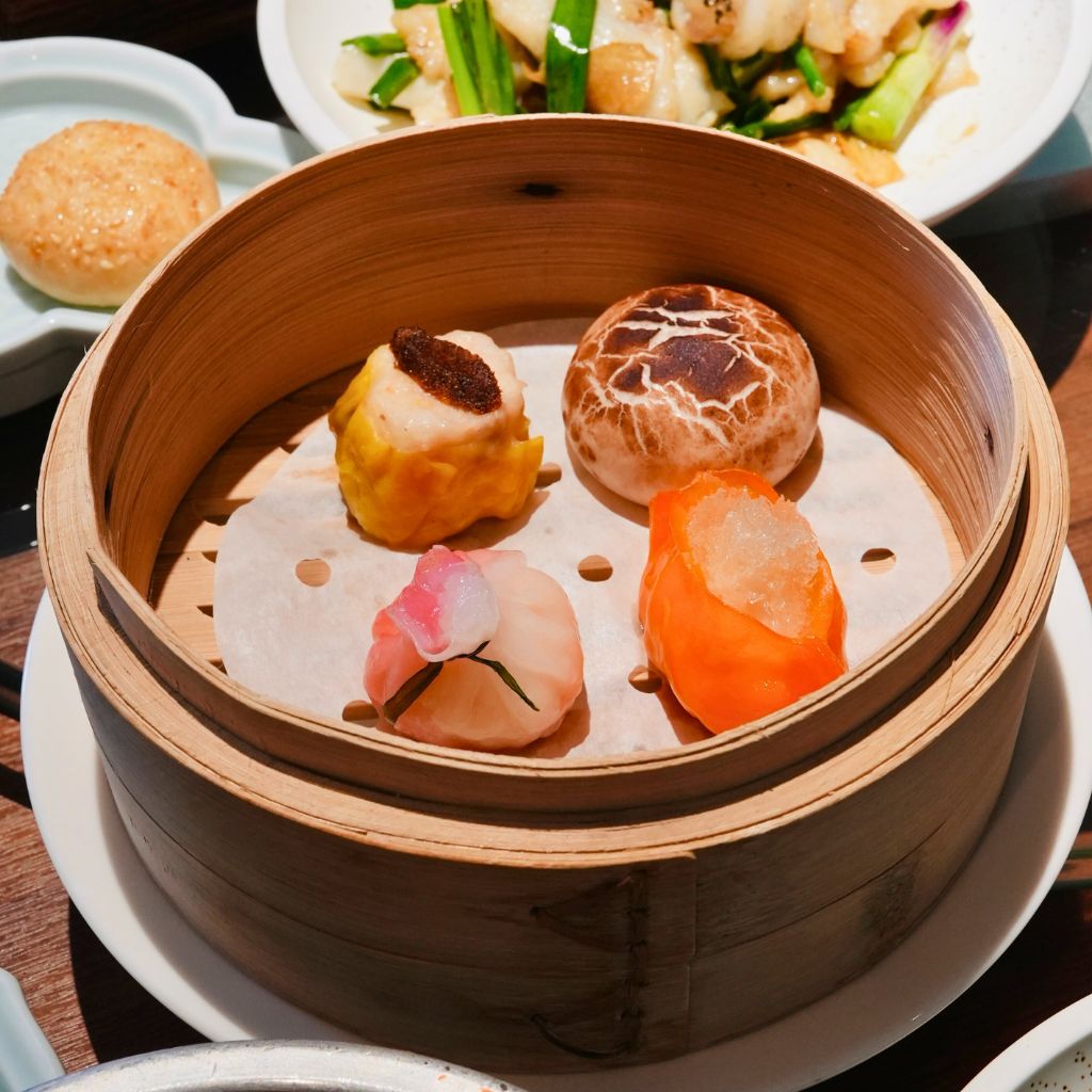 Premium dim sum platter, clockwise from left: Steamed “shao mai” with sea urchin, steamed mushroom bun with minced chicken, steamed prawn dumpling with bird’s nest, and steamed pomegranate seafood dumpling. Photo: Shannon Yap/HungryGoWhere si chuan dou hua
