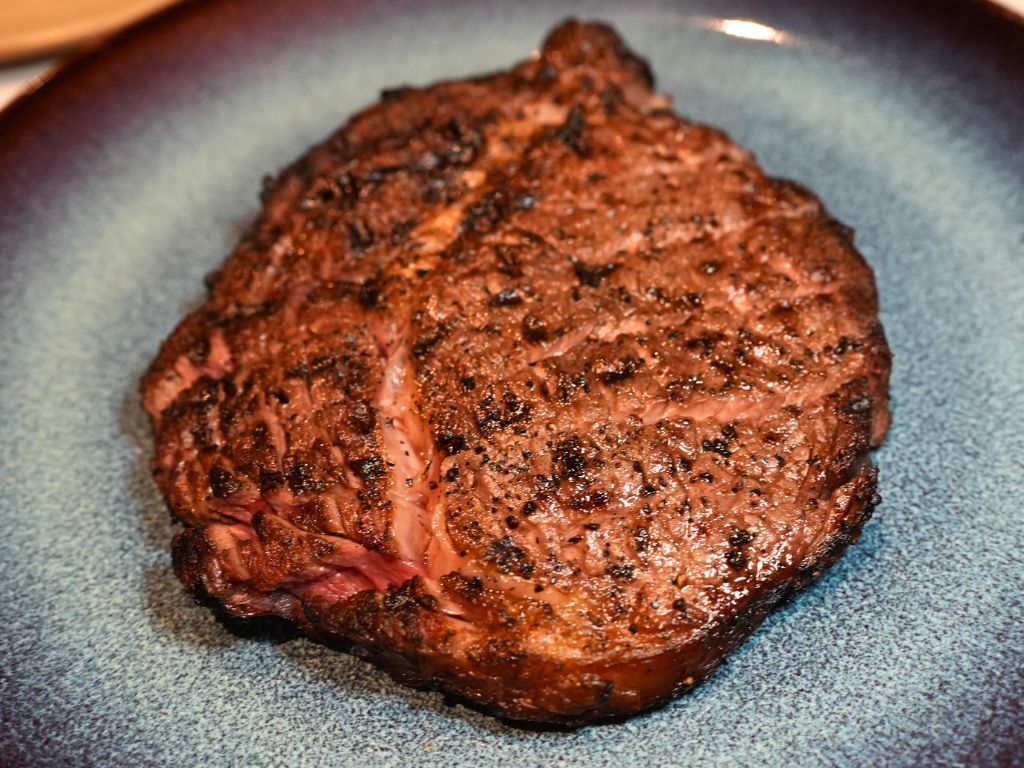The 300g fire-kissed black angus ribeye. Photo: Angeline Ang/HungryGoWhere the butcher's table