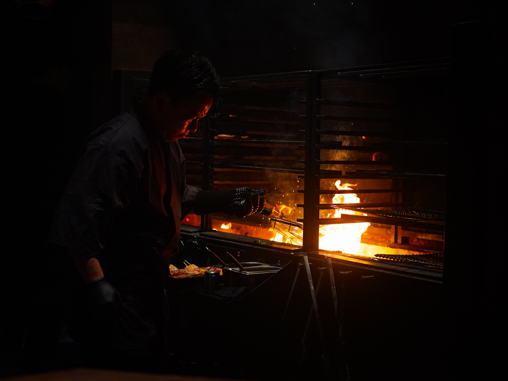 The wood-fire cooking is gloriously on show. Photo: Evan Mua/HungryGoWhere firebird by suetomi