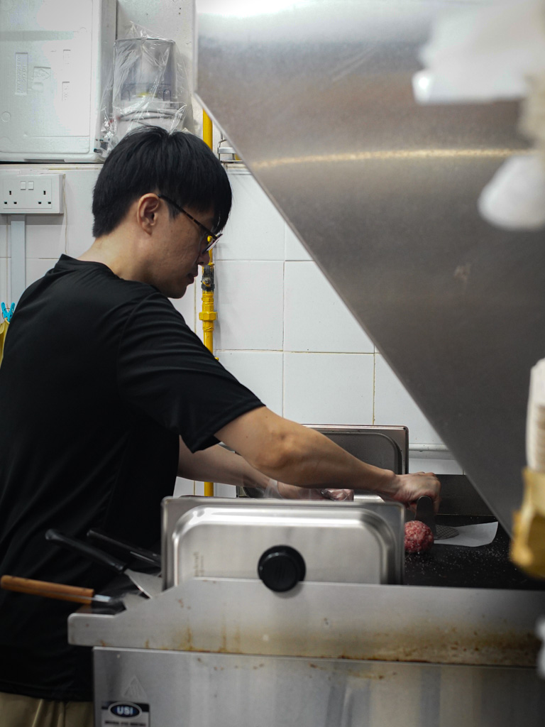 The hawker life has been fulfilling so far. Photo: Evan Mua/HungryGoWhere kine burgers