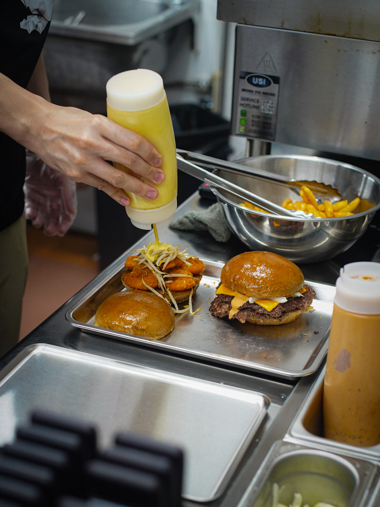 Burgers are one of his favourite foods — so he stuck with it. Photo: Evan Mua/HungryGoWhere kine burgers