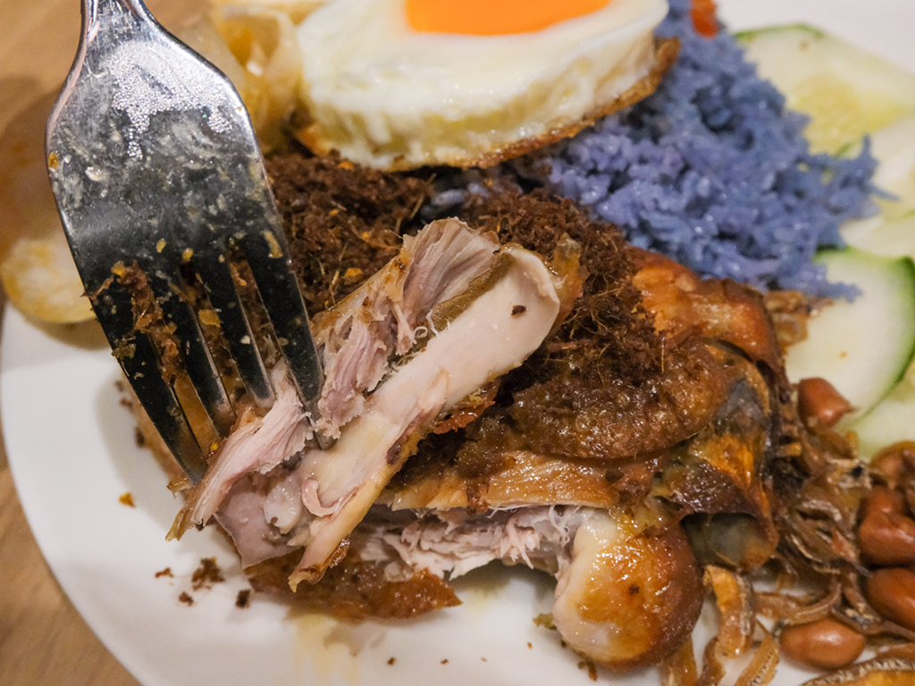 The ayam berempah falls apart easily with a fork. Photo: Gary Lim/HungryGoWhere baby fangs