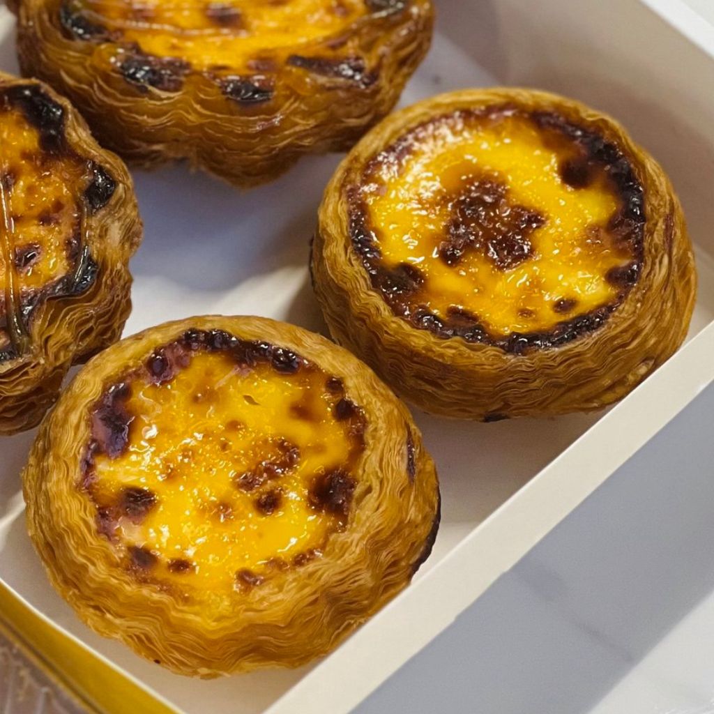 Golden Portuguese egg tart. Photo: Shannon Yap/HungryGoWhere bao's pastry