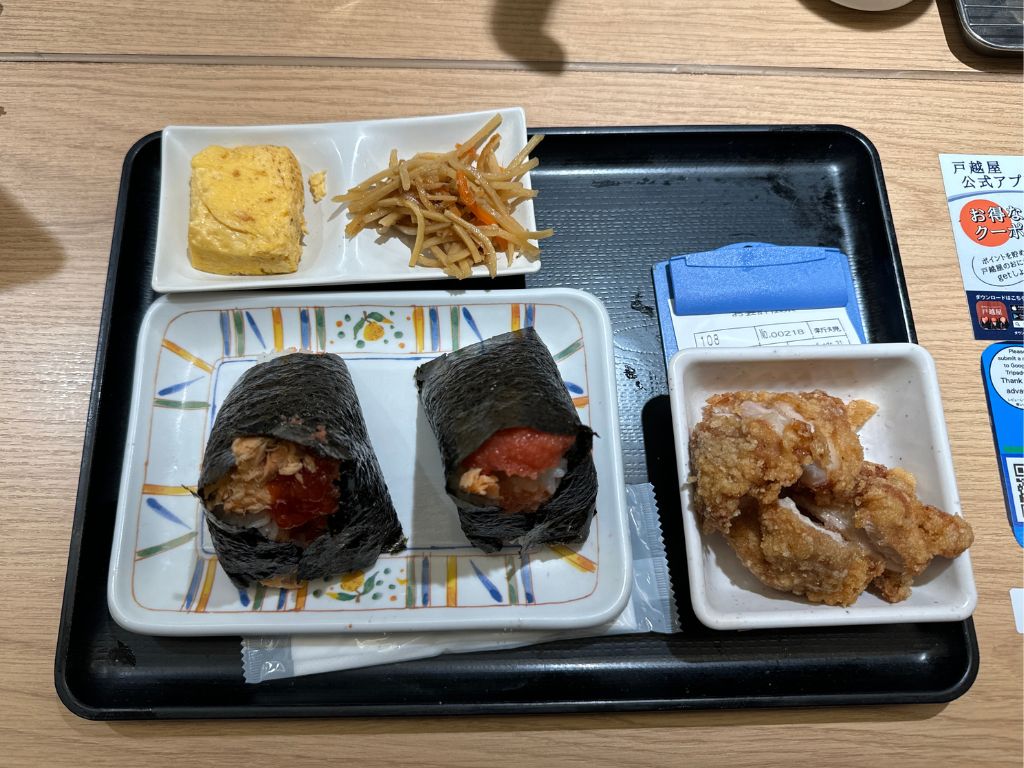 This is combo C, featuring two small rice balls and the various sides. Photo: Gaelmaine Hoong/HungryGoWhere tokyo food