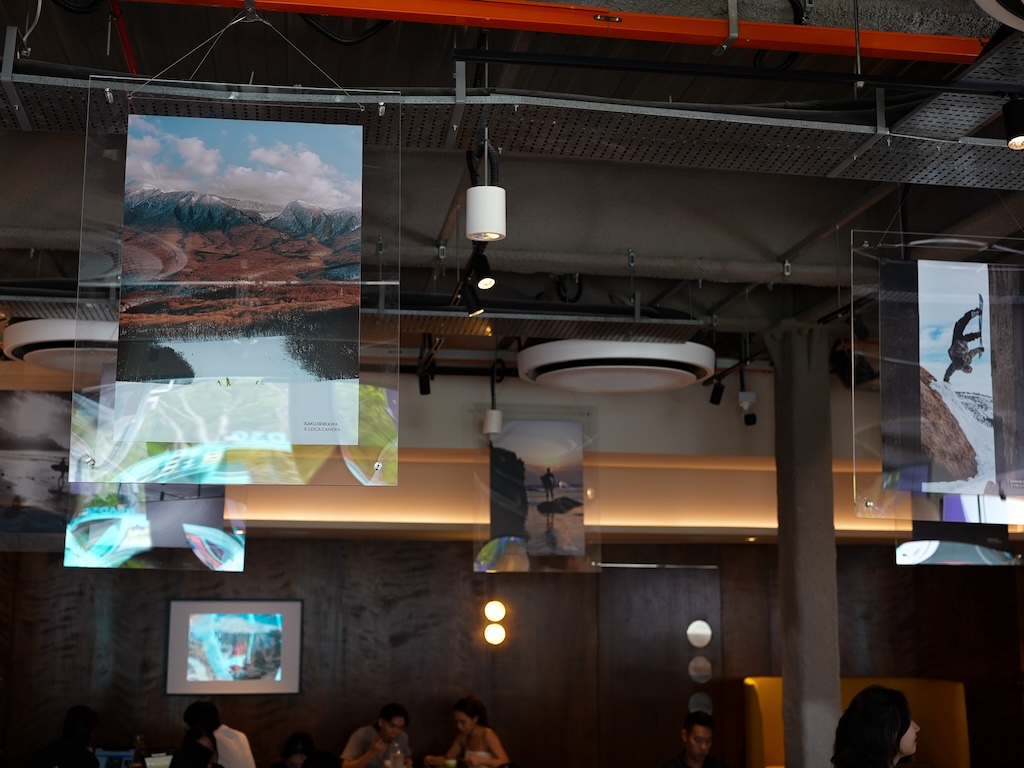 The works of Leica’s photographers, suspended from the ceiling. Photo: Angeline Ang/HungryGoWhere trifecta riders lounge