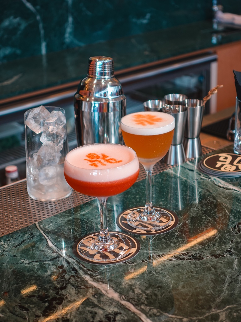 A signature cocktail and a classic whisky sour. Photo: Sarah Chua/HungryGoWhere din tai fung RWS weave