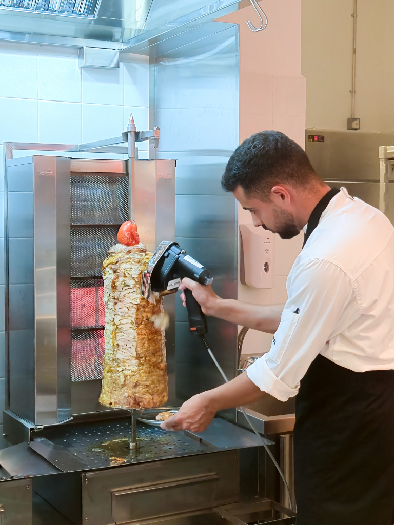 Chicken shawarma being sliced. Photo: Zawani Abdul Ghani/HungryGoWhere wewa orchard gateway