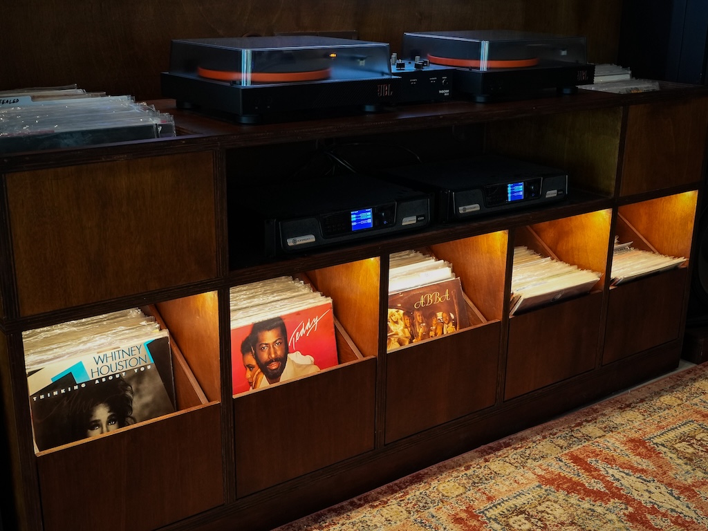 A sweet curated vinyl selection anchors the cosy corner that takes centre stage during the Sunset & Vinyl sessions. Photo: Angeline Ang/HungryGoWhere trifecta riders lounge