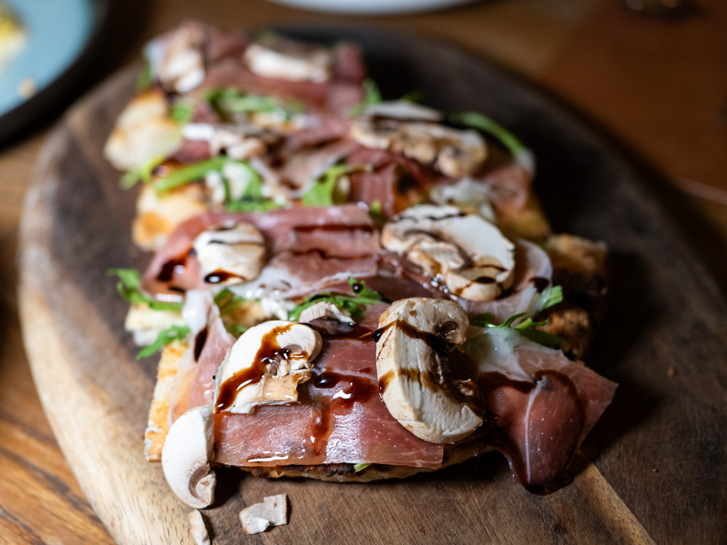 Truffle cream, Parma ham, arugula, and balsamic — this pizza hits all the right notes. Photo: Angeline Ang/HungryGoWhere il giardino botanic gardens