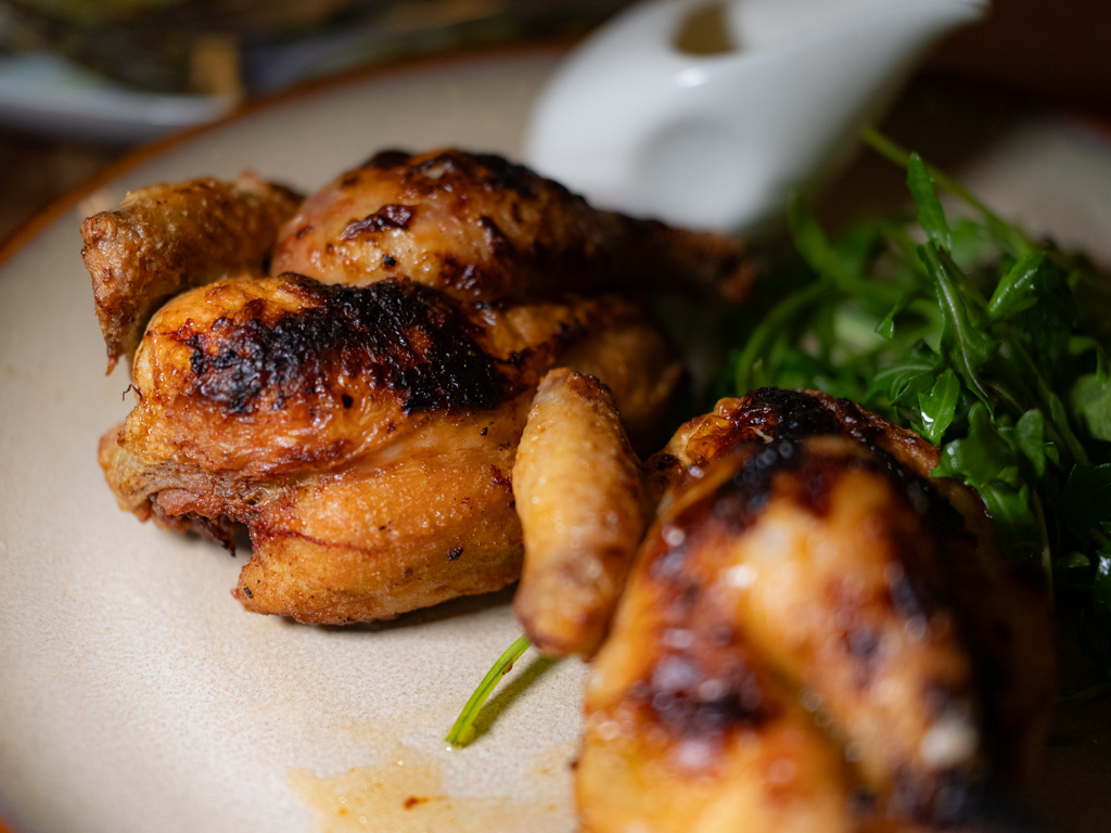 Roasted chicken with fennel-orange salad and lemon caper butter sauce. Photo: Angeline Ang/HungryGoWhere il giardino botanic gardens