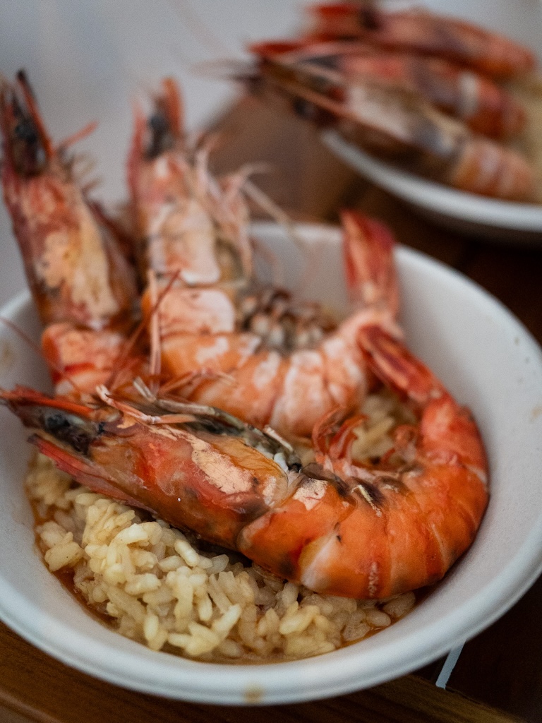 Plump, juicy tiger prawns resting atop creamy risotto. Photo: Angeline Ang/HungryGoWhere sentosa grillfest 2025
