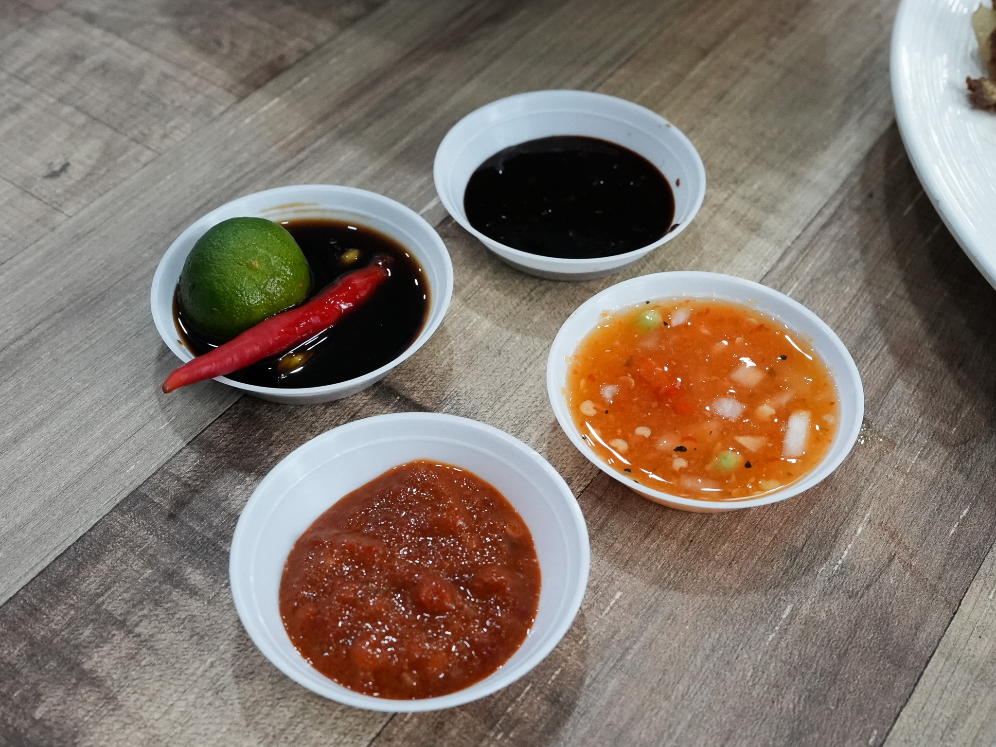 Both Filipino and Malay flavours are honoured here — with vinegar-based sauces alongside fiery sambal. Photo: Angeline Ang/HungryGoWhere nanay's kitchen