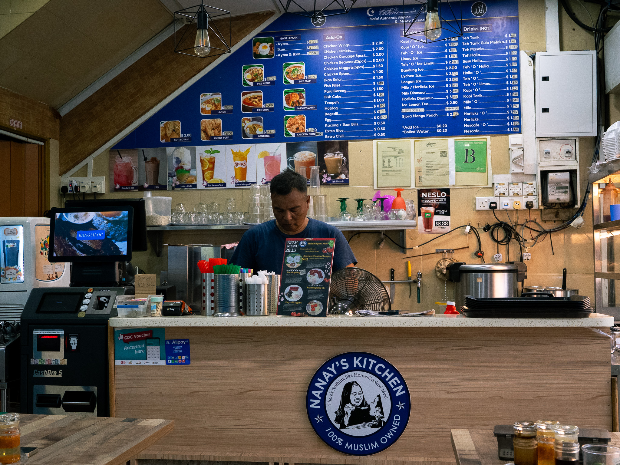 Behind the counter at Nanay’s Kitchen, Saifuddin welcomes you into an inviting space. Photo: Angeline Ang/HungryGoWhere nanay's kitchen