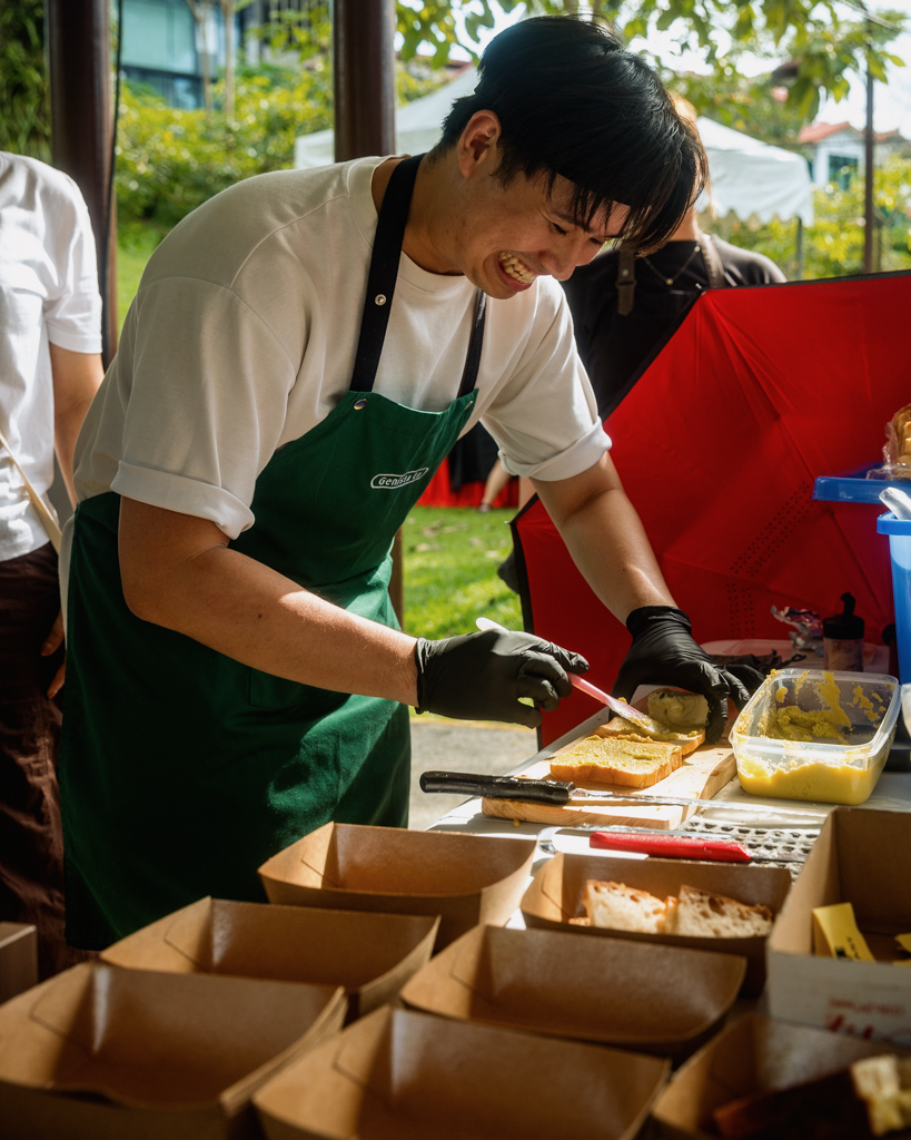 Manfred juggles different tasks behind the cart, making kaya toast, taking orders and brewing coffee. Photo: Ravin Thiruchelvam/HungryGoWhere genista lane kopi