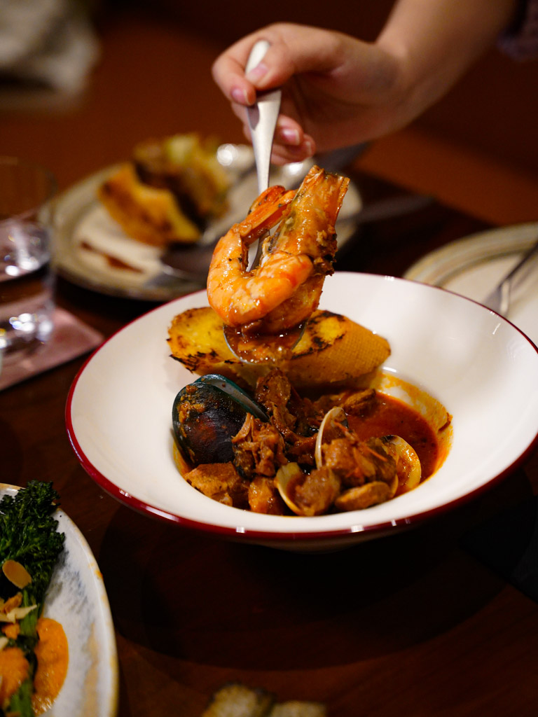 Garlic bread and this stew is a winning combo. Photo: Evan Mua/HungryGoWhere smolder seafood grill