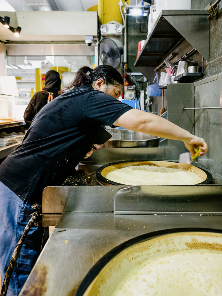 It’s prepared on a big iron pan. Photo: Ravin Thiruchelvam/HungryGoWhere min jiang kueh