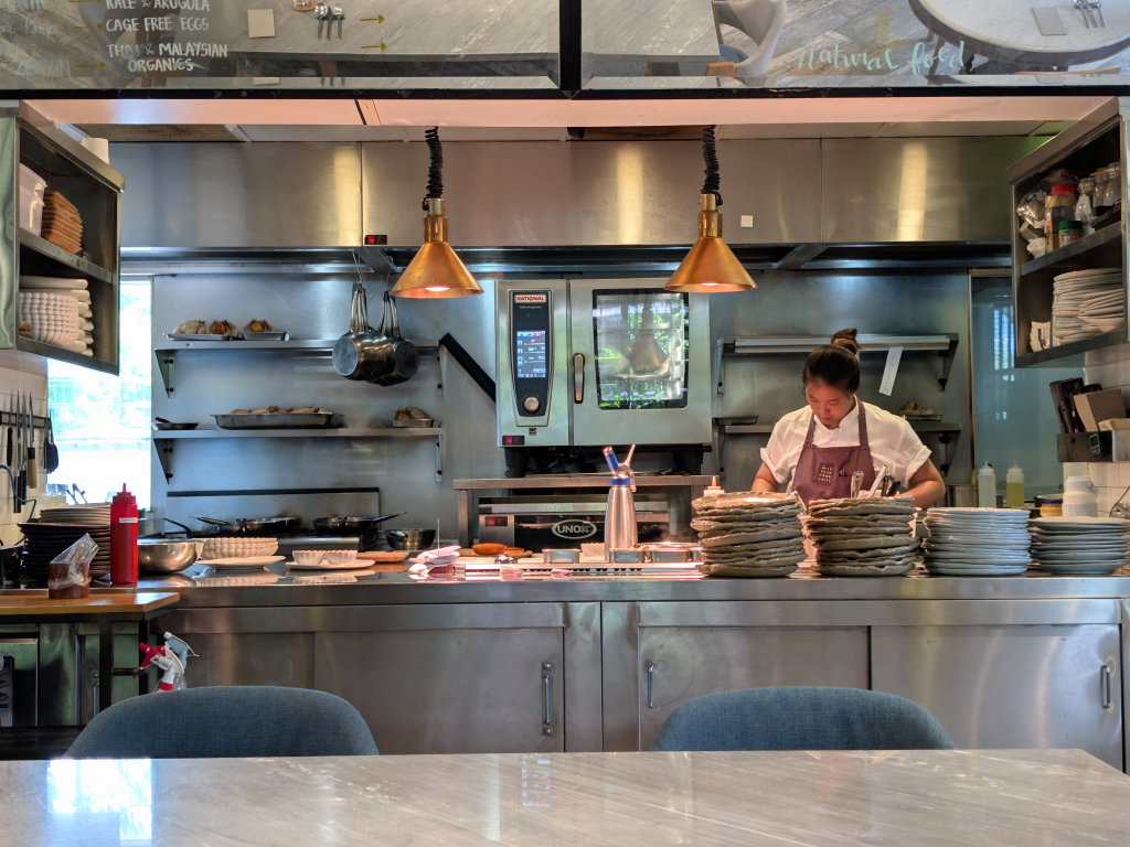 The dining area looks into the open kitchen, allowing diners a peek into the chefs’ prep. Photo: Zawani Abdul Ghani/HungryGoWhere open farm community brunch