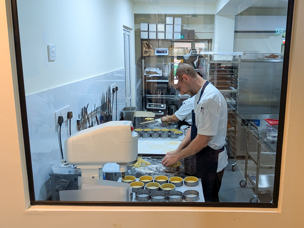 Watch the bakers, including Jean Denis, laminating dough and layering tarts through the glass windows at the back. Photo: Gary Lim/HungryGoWhere bastille bakery joo chiat