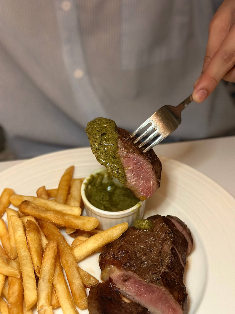 Steak dipped in chimichurri sauce. Photo: Shannon Ong/HungryGoWhere hathaway capital tower