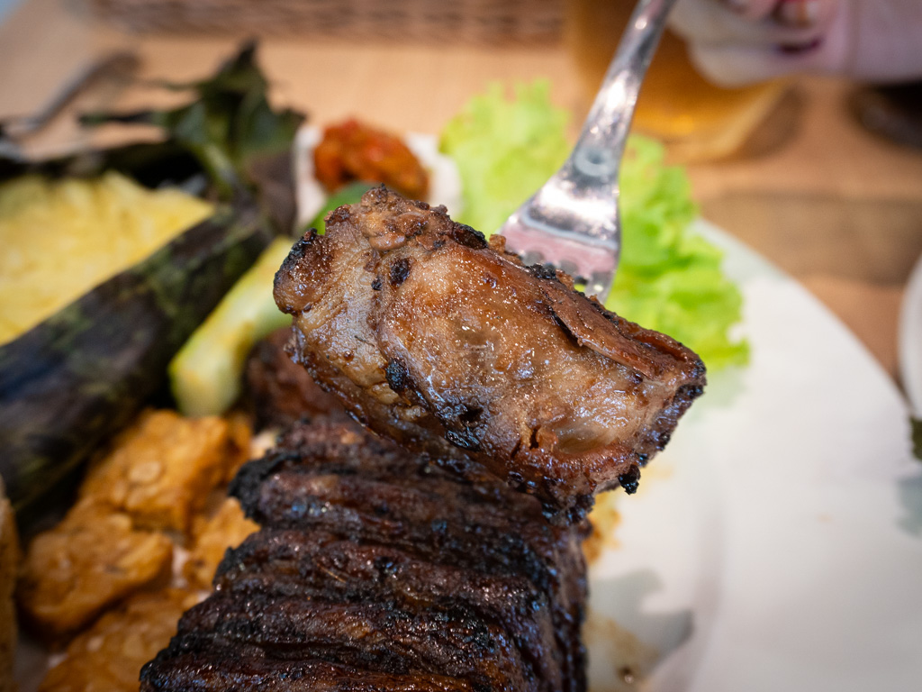 Flame-kissed iberico pork collar — smoky, sweet, and super tender. Photo: Angeline Ang/HungryGoWhere on embers chef x