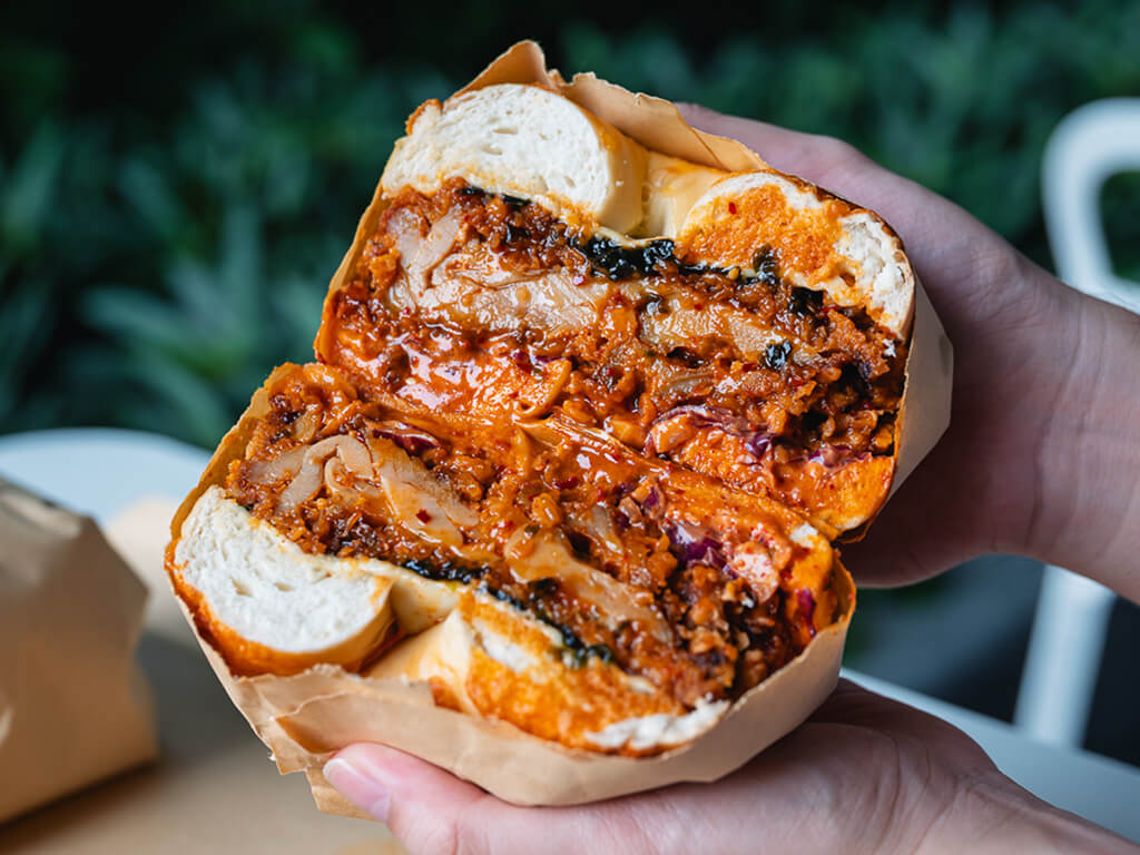 The Korean Fried Chicken, or cheekily dubbed KFC, is a hearty, spicy bagel number with tender chicken thigh and homemade daikon-kimchi slaw. Photo: Abdul Rahim Anwar/HungryGoWhere The Bagel Bunch