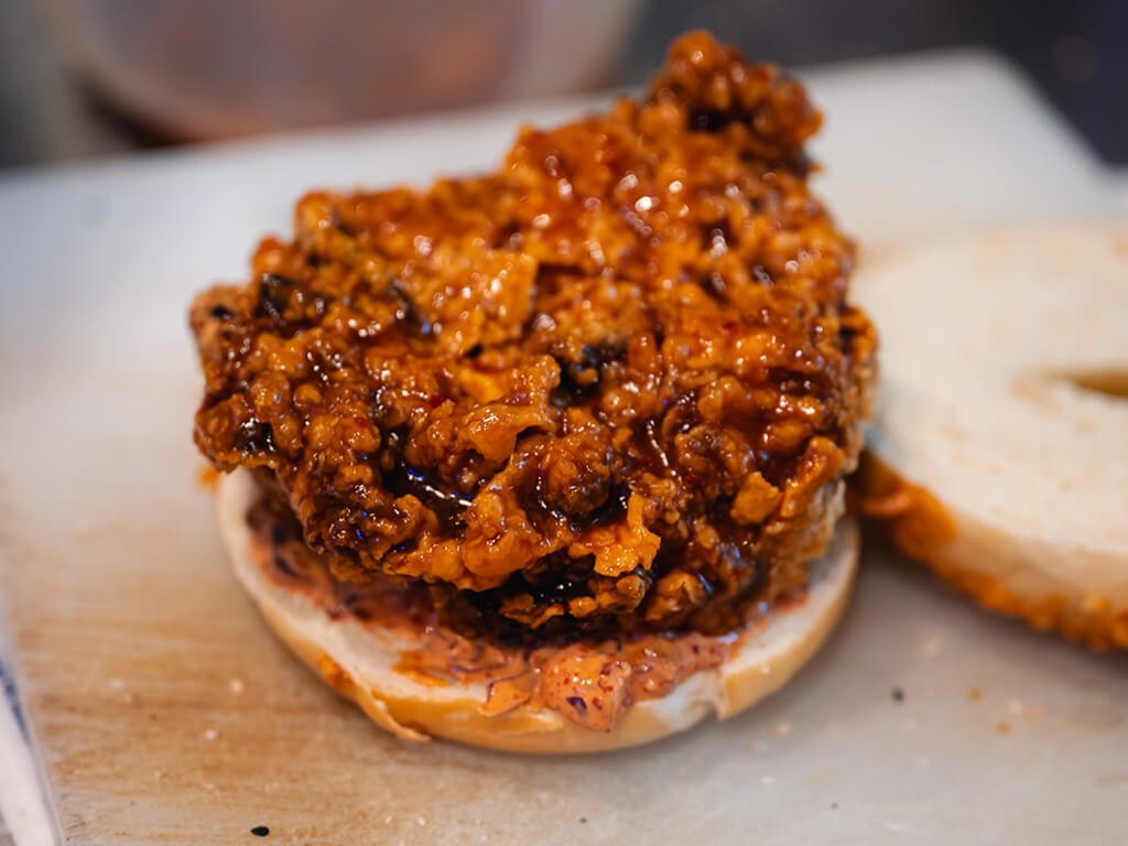 Before it is fried, the chicken thigh was marinated with gochujang sauce and spices. Photo: Abdul Rahim Anwar/HungryGoWhere The Bagel Bunch