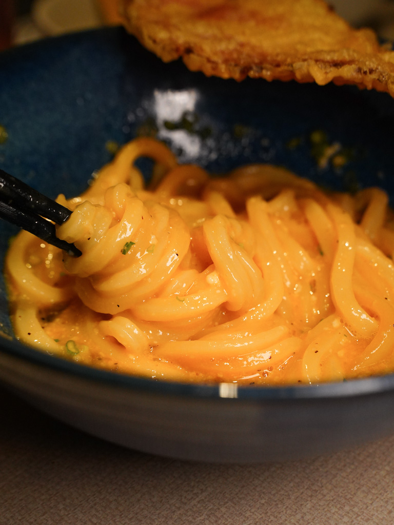 It even looks like carbonara pasta when everything is mixed together. Photo: Evan Mua/HungryGoWhere udon shin singapore