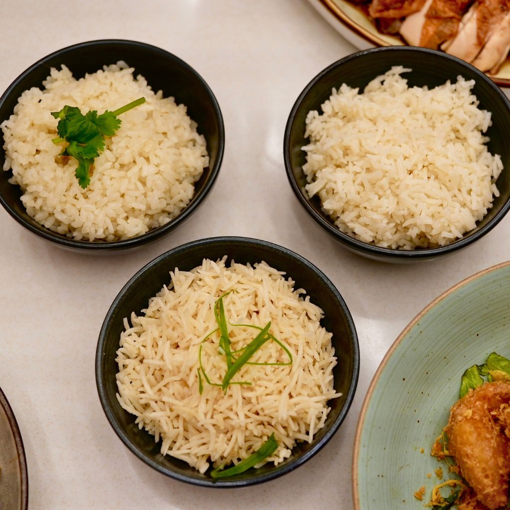 Clockwise from left: Niigata koshihikari rice, the signature chicken rice, and basmati rice. Photo: Shannon Yap/HungryGoWhere Tiong Bahru Hainanese Boneless Chicken Rice Takashimaya