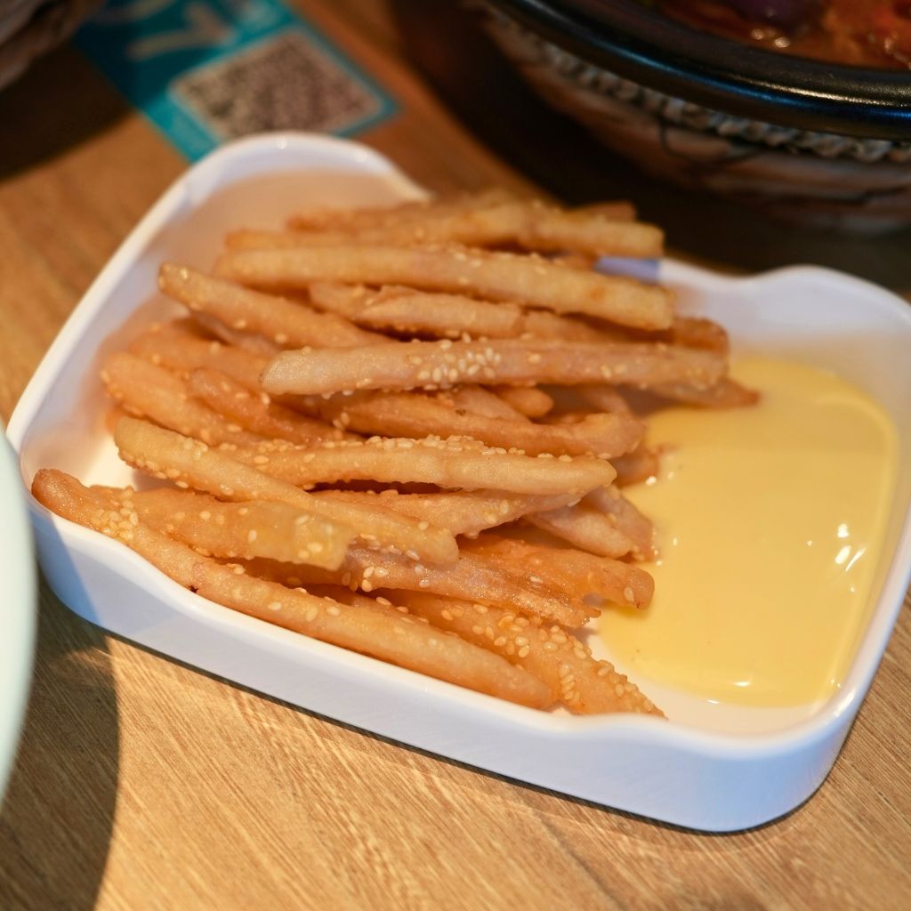 Don’t let its plain, no-frills appearance deceive you. It’s incredibly addictive. Photo: Shannon Yap/HungryGoWhere Putien Mama Singapore