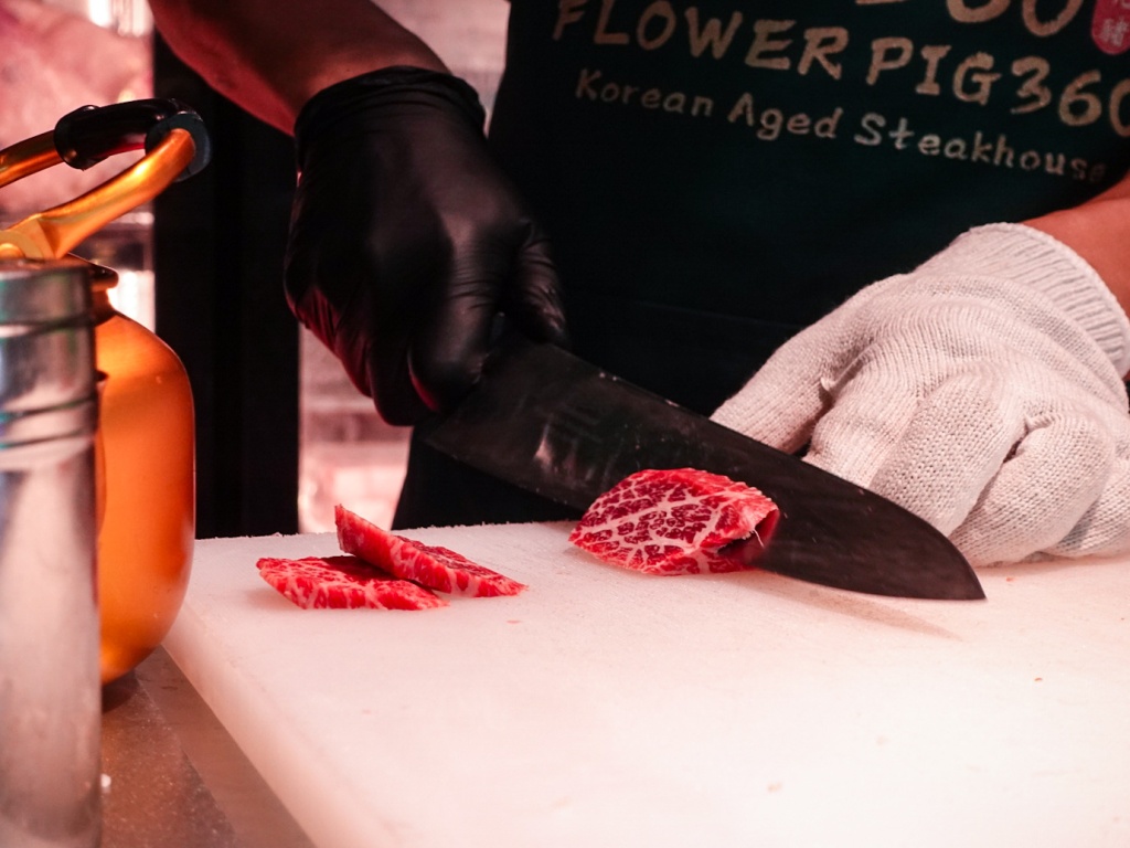 While you may not get to see the actual flower-cut scoring in-person, you can still witness its staff cutting up meats upon order, at its meat counter towards the back of the outlet. Photo: Sarah Chua/HungryGoWhere Kott-Don 360 Paya Lebar
