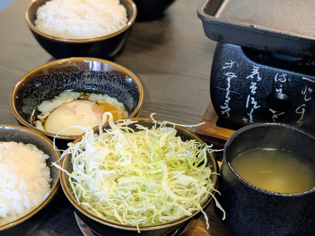 Each set comes with free-flow Japanese rice, cabbage salad, and miso soup. Only the beef sets come with a bowl of onsen egg for dipping. Photo: Zawani Abdul Ghani/HungryGoWhere Gyusei Gyukatsu Wagyu-Steakhouse