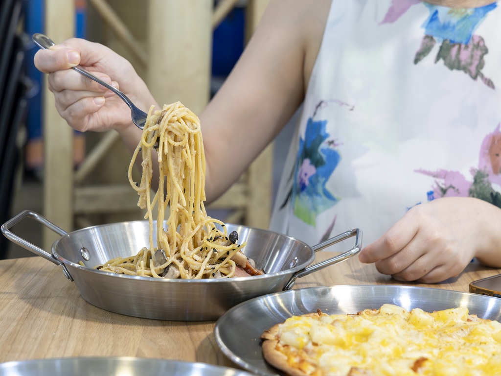 Savouring each strand of the flavourful goma smoked duck pasta. Photo: Koh Mui Fong/HungryGoWhere the pasta & tortizza hougang