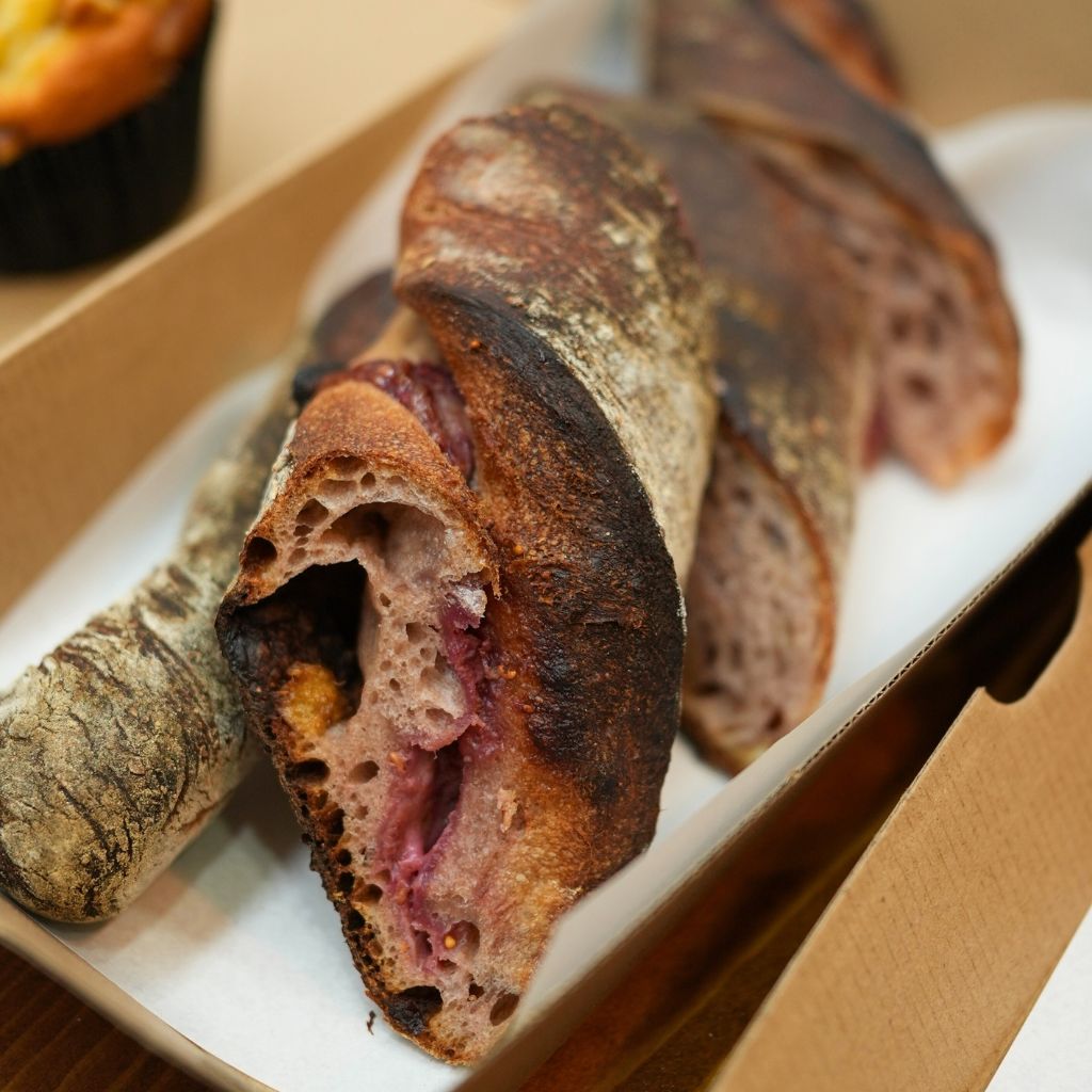 Red wine baguette with cranberry, walnut, and cream cheese. Photo: Shannon Yap/HungryGoWhere new jan openings
