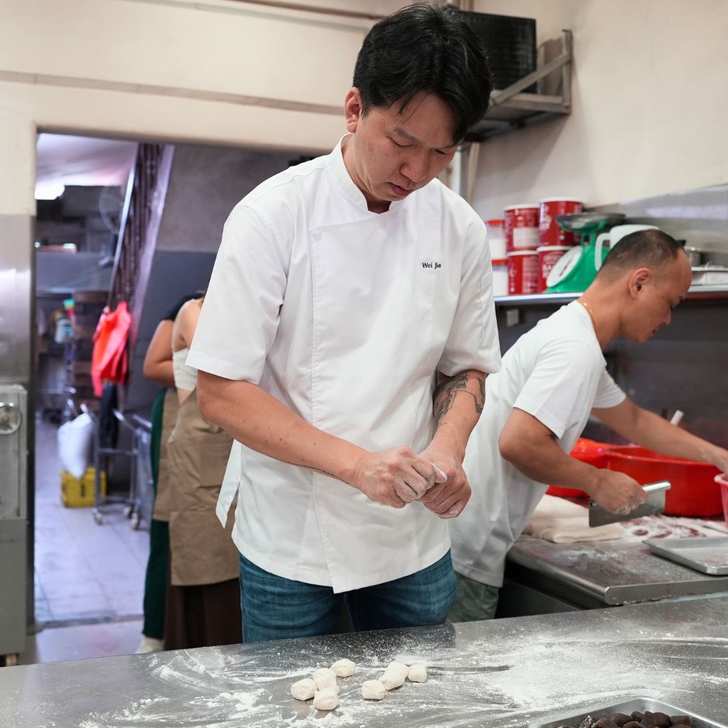 Standing at over 1.8m tall, Wei Jie has to hunch over the counter to hand-fold each bao carefully. Photo: Shannon Yap/HungryGoWhere tanjong rhu pau