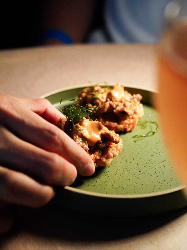 Rendang on rice crisps work so well. Photo: Evan Mua/HungryGoWhere rice @ rasa space